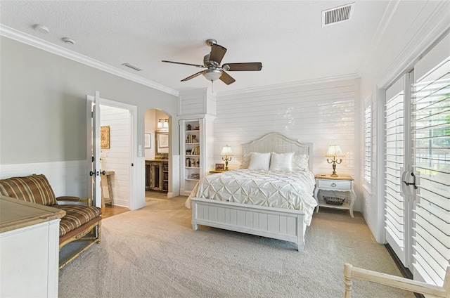 140 Monterey Bay Ln, Green Cove Springs, FL 32043 - carpeted bedroom with arched walkways, ornamental molding, ceiling fan, and ensuite bath