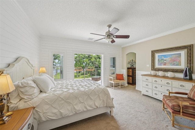 140 Monterey Bay Ln, Green Cove Springs, FL 32043 - bedroom with a textured ceiling, light carpet, crown molding, arched walkways, and ceiling fan