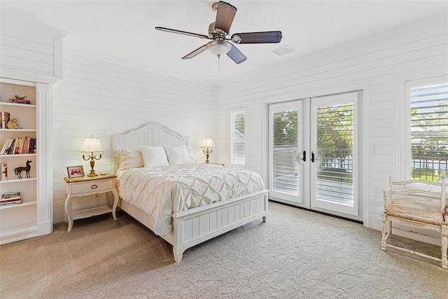 140 Monterey Bay Ln, Green Cove Springs, FL 32043 - bedroom with access to exterior, french doors, light carpet, crown molding, and wood walls