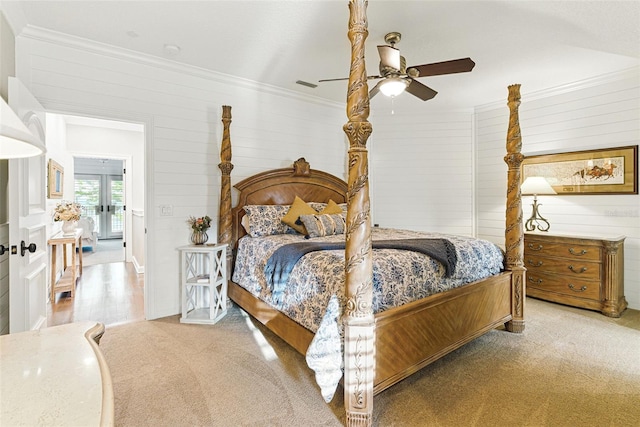 140 Monterey Bay Ln, Green Cove Springs, FL 32043 - carpeted bedroom featuring french doors, ornamental molding, wooden walls, and a ceiling fan