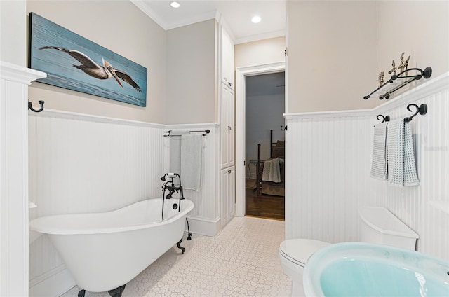 140 Monterey Bay Ln, Green Cove Springs, FL 32043 - full bathroom featuring a freestanding bath, a wainscoted wall, a sink, ornamental molding, and a decorative wall