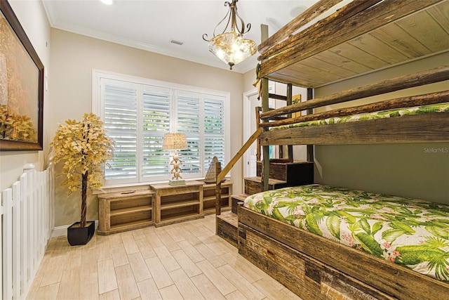 140 Monterey Bay Ln, Green Cove Springs, FL 32043 - bedroom with light wood-style flooring, crown molding, and a chandelier