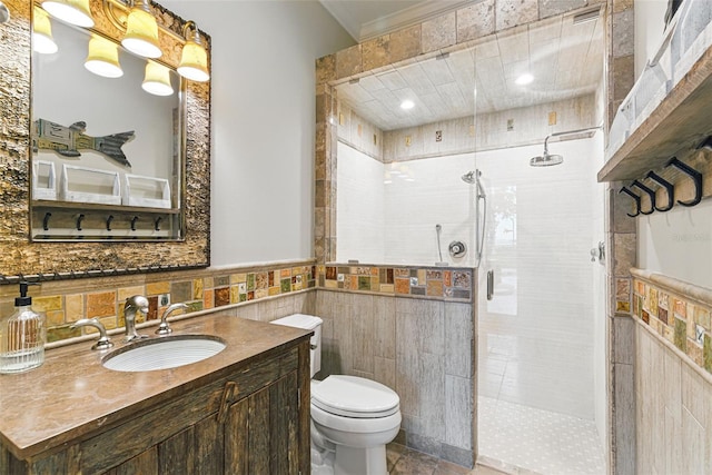 140 Monterey Bay Ln, Green Cove Springs, FL 32043 - full bath featuring tile walls, a shower stall, vanity, toilet, and a wainscoted wall