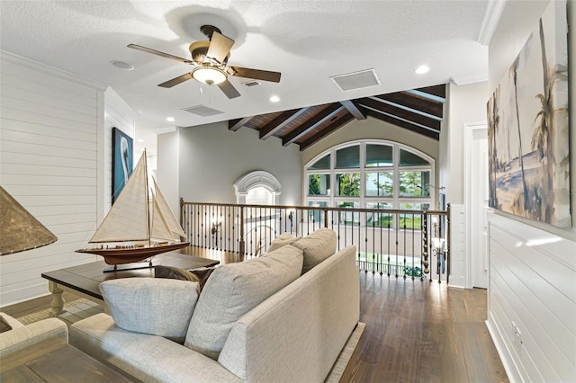 140 Monterey Bay Ln, Green Cove Springs, FL 32043 - living room featuring a ceiling fan, wood-type flooring, wood walls, and a textured ceiling