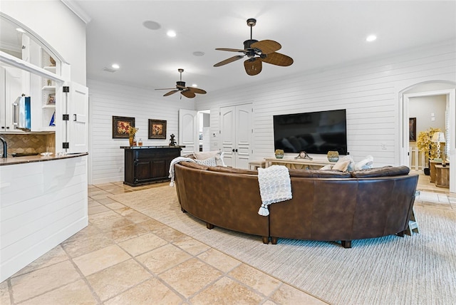 140 Monterey Bay Ln, Green Cove Springs, FL 32043 - living area with arched walkways, recessed lighting, ceiling fan, and stone tile flooring