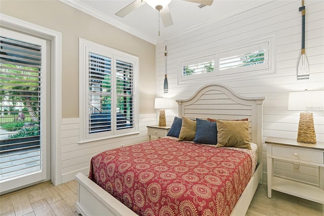 140 Monterey Bay Ln, Green Cove Springs, FL 32043 - bedroom featuring light wood finished floors, ornamental molding, access to exterior, wooden walls, and ceiling fan
