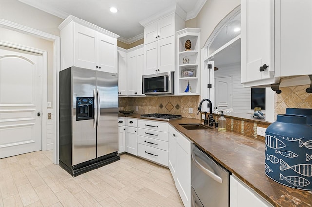 140 Monterey Bay Ln, Green Cove Springs, FL 32043 - kitchen with appliances with stainless steel finishes, a sink, open shelves, dark countertops, and crown molding