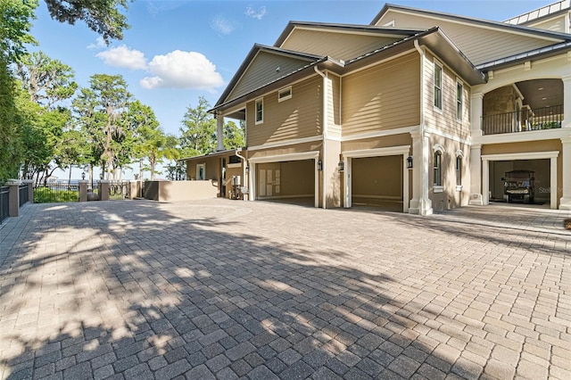 140 Monterey Bay Ln, Green Cove Springs, FL 32043 - view of home's exterior featuring a garage and decorative driveway
