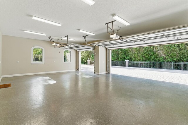 140 Monterey Bay Ln, Green Cove Springs, FL 32043 - garage featuring a garage door opener and baseboards