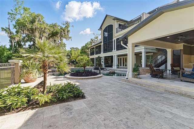 140 Monterey Bay Ln, Green Cove Springs, FL 32043 - view of home's community featuring stairway, a pool, and a patio
