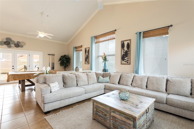200 Bella Harbor Ct Unit 113, Palm Coast, FL 32137 - living area with light tile patterned floors, crown molding, high vaulted ceiling, ceiling fan, and french doors