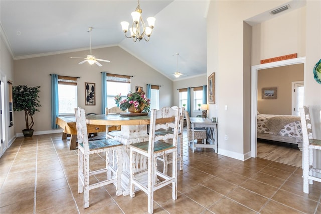 200 Bella Harbor Ct Unit 113, Palm Coast, FL 32137 - dining space featuring a ceiling fan, a chandelier, light tile patterned floors, baseboards, and high vaulted ceiling