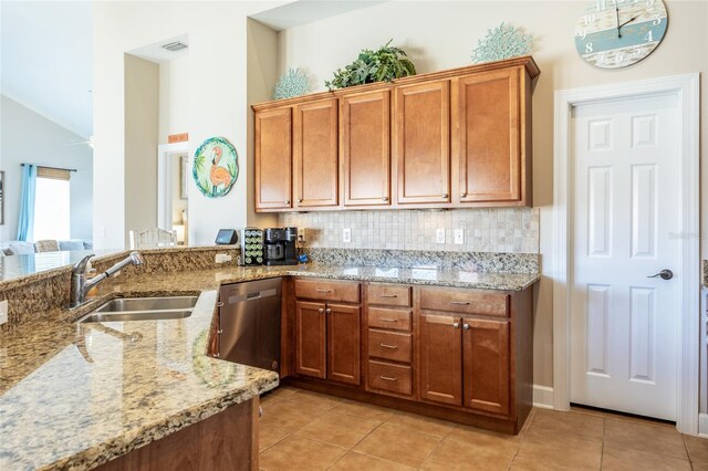 200 Bella Harbor Ct Unit 113, Palm Coast, FL 32137 - kitchen featuring a sink, stainless steel dishwasher, light tile patterned flooring, light stone counters, and brown cabinets
