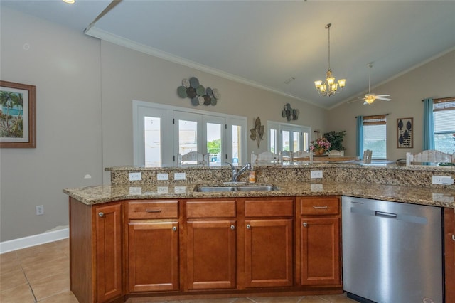 200 Bella Harbor Ct Unit 113, Palm Coast, FL 32137 - kitchen featuring stainless steel dishwasher, a sink, crown molding, lofted ceiling, and brown cabinets