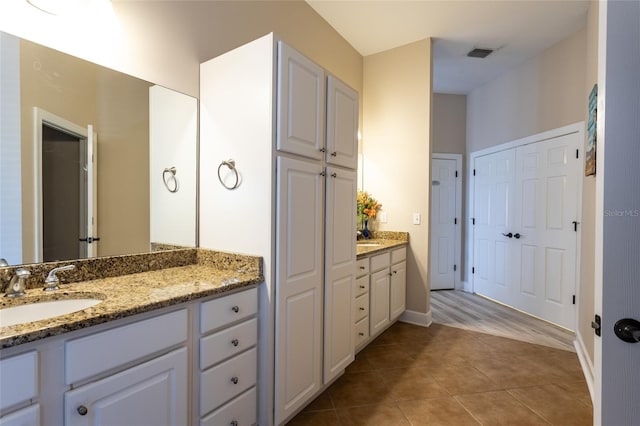 200 Bella Harbor Ct Unit 113, Palm Coast, FL 32137 - full bathroom featuring vanity, tile patterned flooring, and baseboards