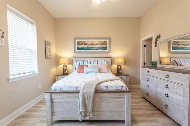 200 Bella Harbor Ct Unit 113, Palm Coast, FL 32137 - bedroom featuring light wood-style flooring and baseboards