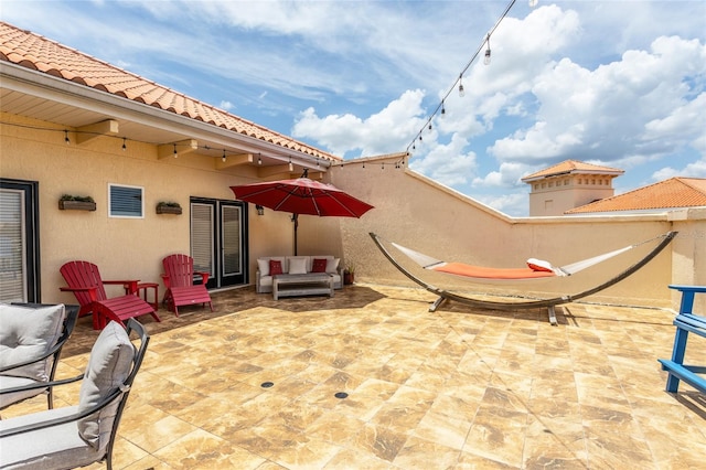 200 Bella Harbor Ct Unit 113, Palm Coast, FL 32137 - view of patio with an outdoor living space