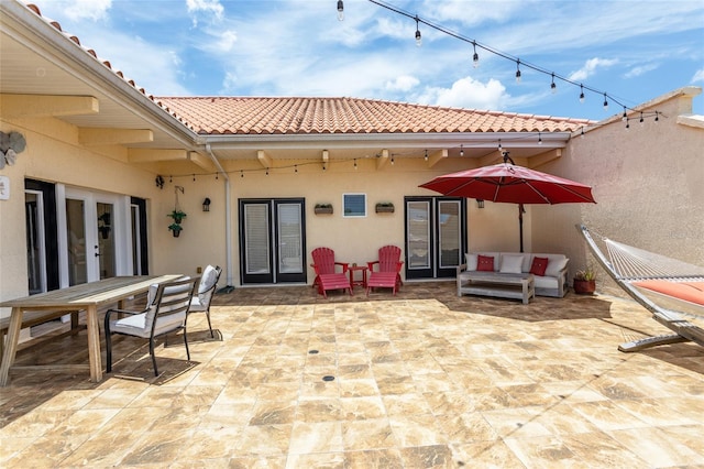 200 Bella Harbor Ct Unit 113, Palm Coast, FL 32137 - view of patio featuring french doors, outdoor dining area, and outdoor lounge area