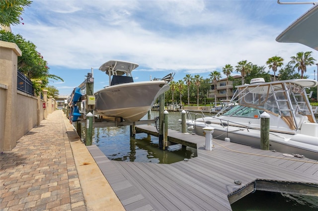 200 Bella Harbor Ct Unit 113, Palm Coast, FL 32137 - dock featuring boat lift and a water view