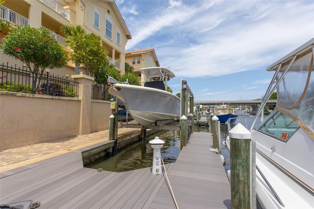 200 Bella Harbor Ct Unit 113, Palm Coast, FL 32137 - dock area featuring boat lift and a water view