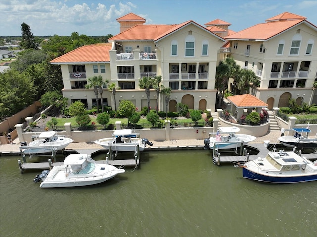 200 Bella Harbor Ct Unit 113, Palm Coast, FL 32137 - back of property featuring stucco siding, a water view, and a tile roof