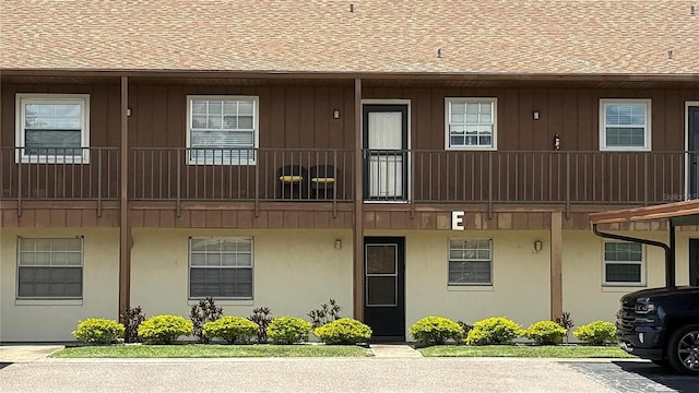 1640 Juno Trl Unit 202E, Astor, FL 32102 - view of building exterior with uncovered parking