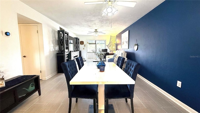 1640 Juno Trl Unit 202E, Astor, FL 32102 - dining space with a ceiling fan and baseboards