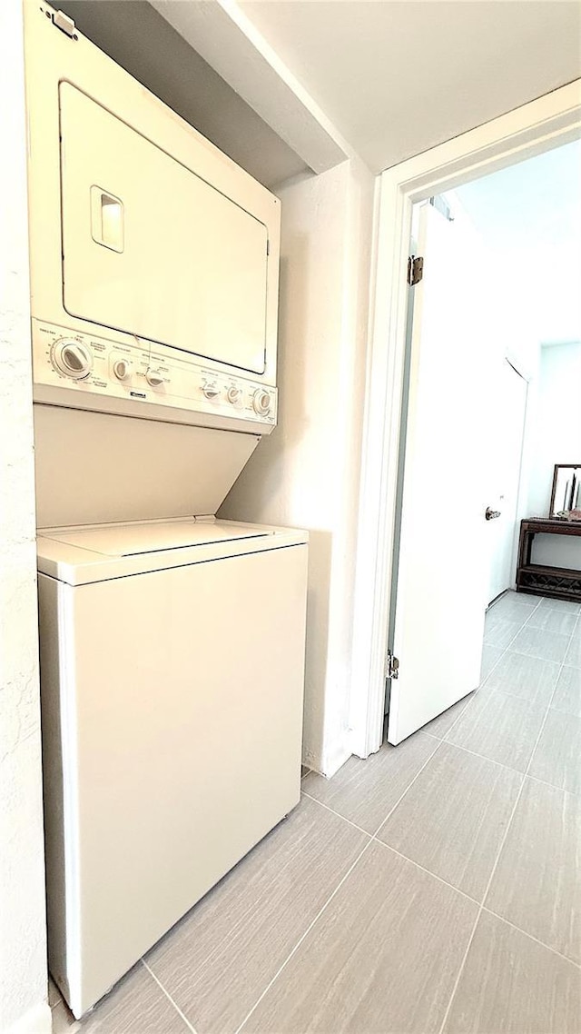 1640 Juno Trl Unit 202E, Astor, FL 32102 - laundry area with stacked washer / drying machine