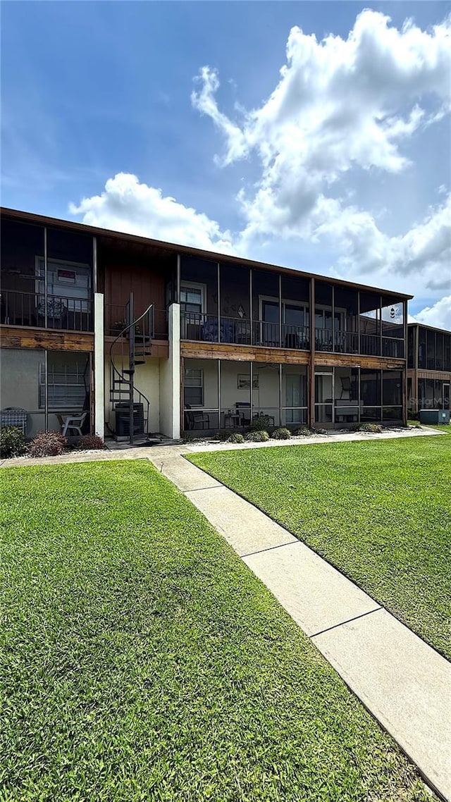 1640 Juno Trl Unit 202E, Astor, FL 32102 - view of building exterior featuring stairway