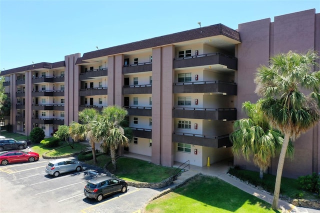 640 N Nova Rd Unit 117, Ormond Beach, FL 32174 - view of apartment building / complex featuring uncovered parking