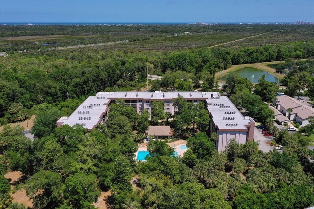 640 N Nova Rd Unit 117, Ormond Beach, FL 32174 - drone / aerial view of a forest and a large body of water