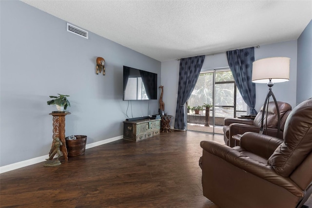 640 N Nova Rd Unit 117, Ormond Beach, FL 32174 - living room with a textured ceiling, wood finished floors, and baseboards