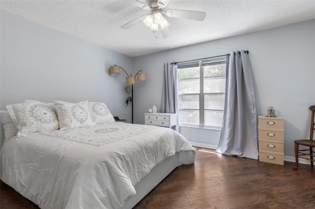640 N Nova Rd Unit 117, Ormond Beach, FL 32174 - bedroom featuring wood finished floors, a textured ceiling, baseboards, and ceiling fan