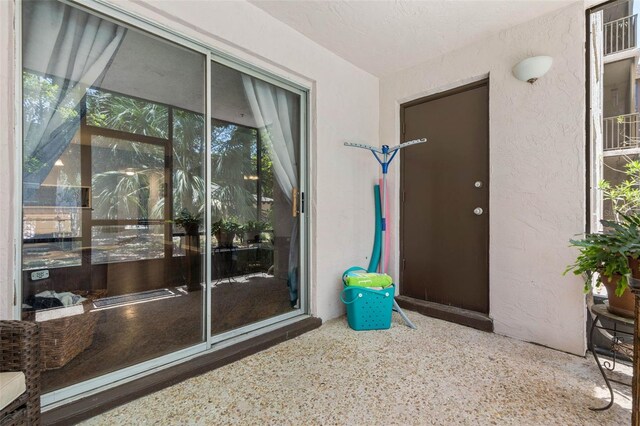 640 N Nova Rd Unit 117, Ormond Beach, FL 32174 - doorway to property with stucco siding