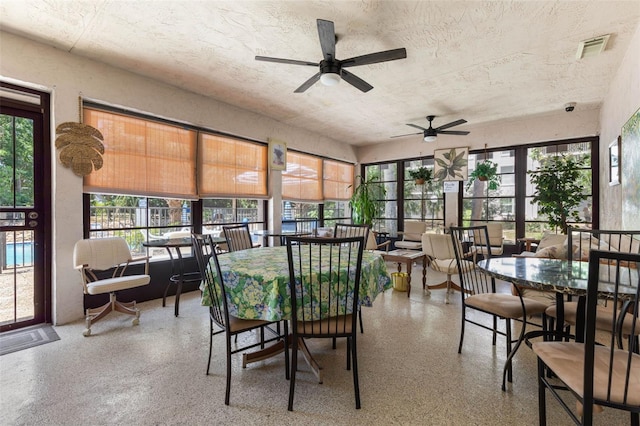 640 N Nova Rd Unit 117, Ormond Beach, FL 32174 - sunroom / solarium with speckle patterned floor and a textured ceiling