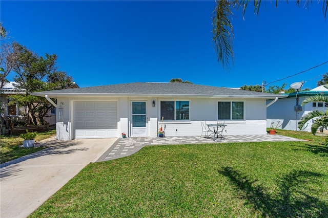 129 Dundee Rd, Daytona Beach, FL 32118 - ranch-style house with a front lawn, a garage, driveway, and stucco siding