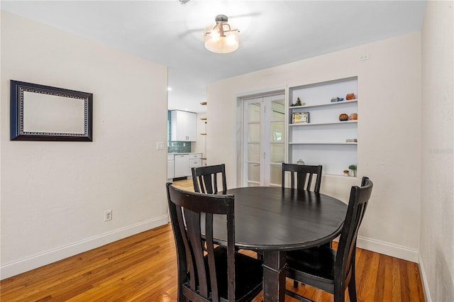 129 Dundee Rd, Daytona Beach, FL 32118 - dining area featuring light wood finished floors and baseboards