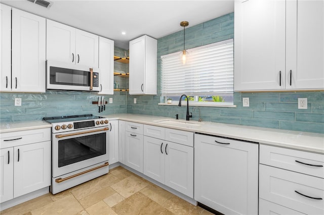 129 Dundee Rd, Daytona Beach, FL 32118 - kitchen with white appliances, a sink, tasteful backsplash, white cabinetry, and light countertops