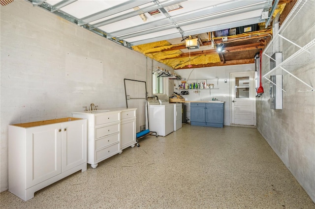 129 Dundee Rd, Daytona Beach, FL 32118 - garage with washing machine and clothes dryer, a sink, and a garage door opener