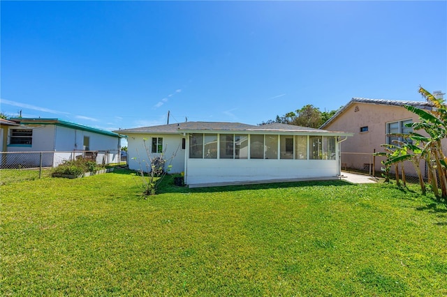 129 Dundee Rd, Daytona Beach, FL 32118 - rear view of house featuring a sunroom