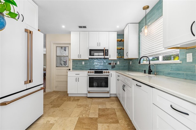 129 Dundee Rd, Daytona Beach, FL 32118 - kitchen featuring white appliances, a sink, tasteful backsplash, light countertops, and recessed lighting