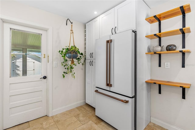 129 Dundee Rd, Daytona Beach, FL 32118 - doorway with baseboards, recessed lighting, and light stone finish floors