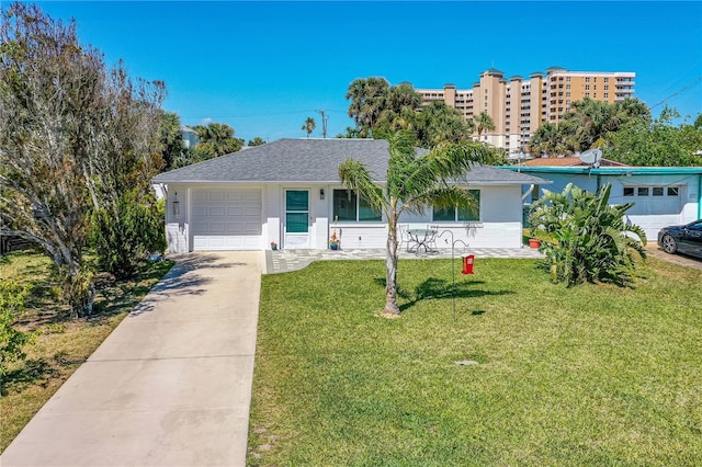 129 Dundee Rd, Daytona Beach, FL 32118 - single story home with a garage, a front lawn, concrete driveway, and a shingled roof