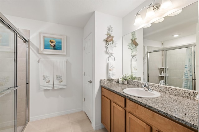 217 Birchwood Dr, Palm Coast, FL 32137 - bathroom with vanity, a shower stall, baseboards, and tile patterned flooring
