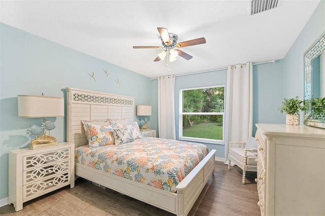217 Birchwood Dr, Palm Coast, FL 32137 - bedroom featuring wood finished floors, baseboards, and a ceiling fan
