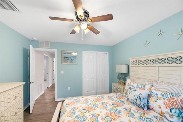 217 Birchwood Dr, Palm Coast, FL 32137 - bedroom with wood finished floors, baseboards, a closet, and ceiling fan