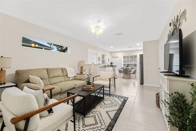 217 Birchwood Dr, Palm Coast, FL 32137 - living area featuring light tile patterned flooring, baseboards, and recessed lighting