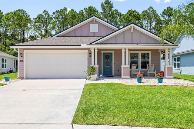 65 Lob Wedge Ln, Bunnell, FL 32110 - view of front facade featuring board and batten siding, covered porch, a front lawn, driveway, and a garage