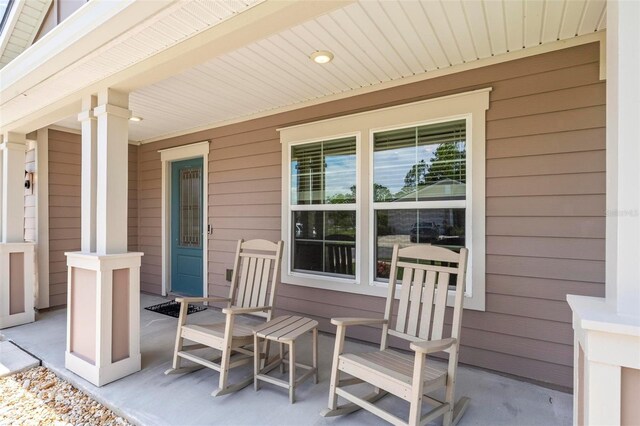 65 Lob Wedge Ln, Bunnell, FL 32110 - view of covered porch