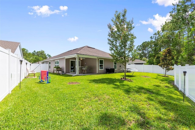 65 Lob Wedge Ln, Bunnell, FL 32110 - rear view of property with a ceiling fan, stucco siding, and a patio area